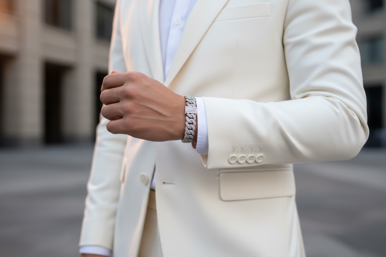 someone with a white suit wearing a 12mm iced out white gold cuban bracelet