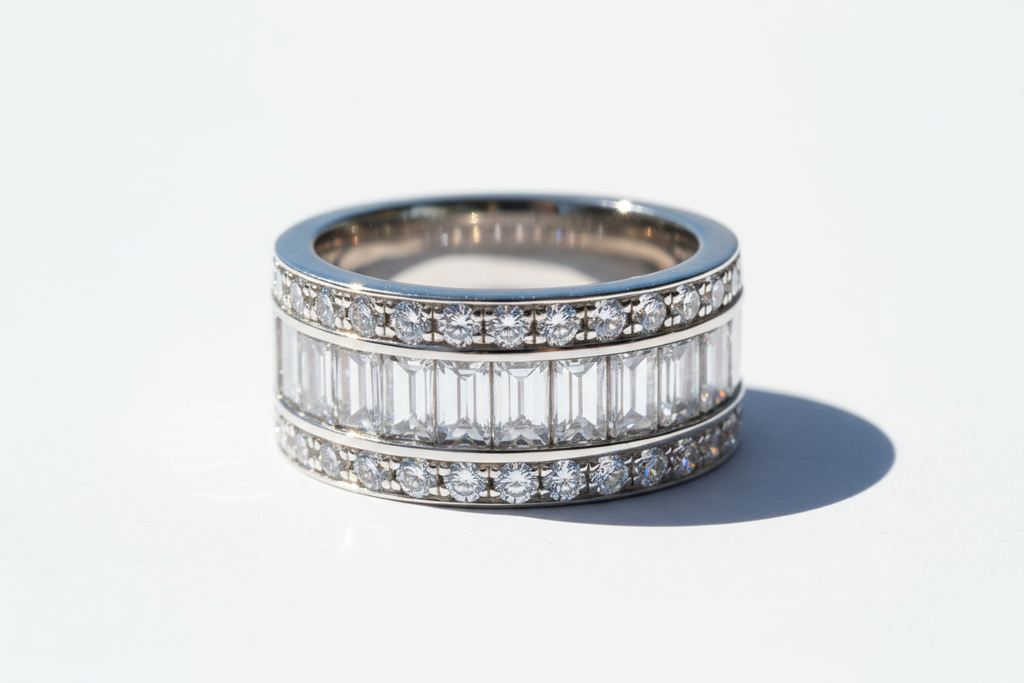 A high-resolution, ultra-realistic photo of a men's diamond band made of 14k white gold. The ring features a wide design with a center row of baguette-cut lab-grown diamonds set horizontally, framed by two rows of round brilliant-cut diamonds on the top and bottom. The ring has a polished white gold finish with a masculine, elegant style, captured on a clean white or neutral background for a luxury jewelry catalog look.